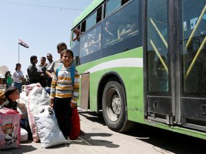 Mudamiye'deki 800 militan, aileleriyle birlikte ilçeden ayrıldı