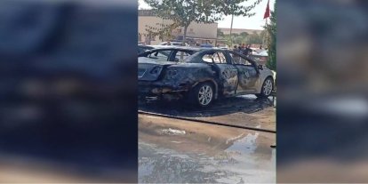 Ceylanpınar Devlet Hastanesi otoparkında park halindeki araç alev aldı
